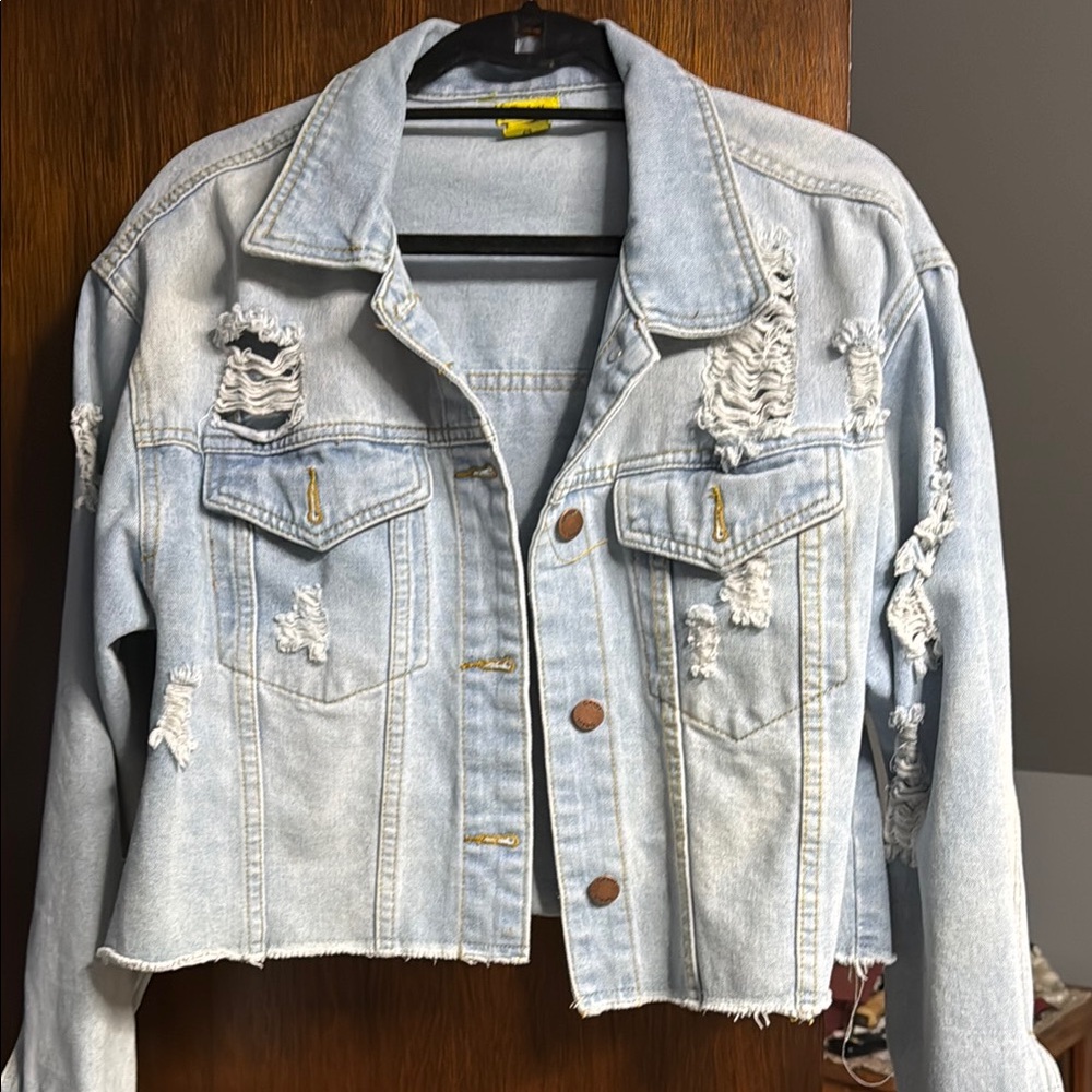 Distressed Jean coat crop length button at the wrist